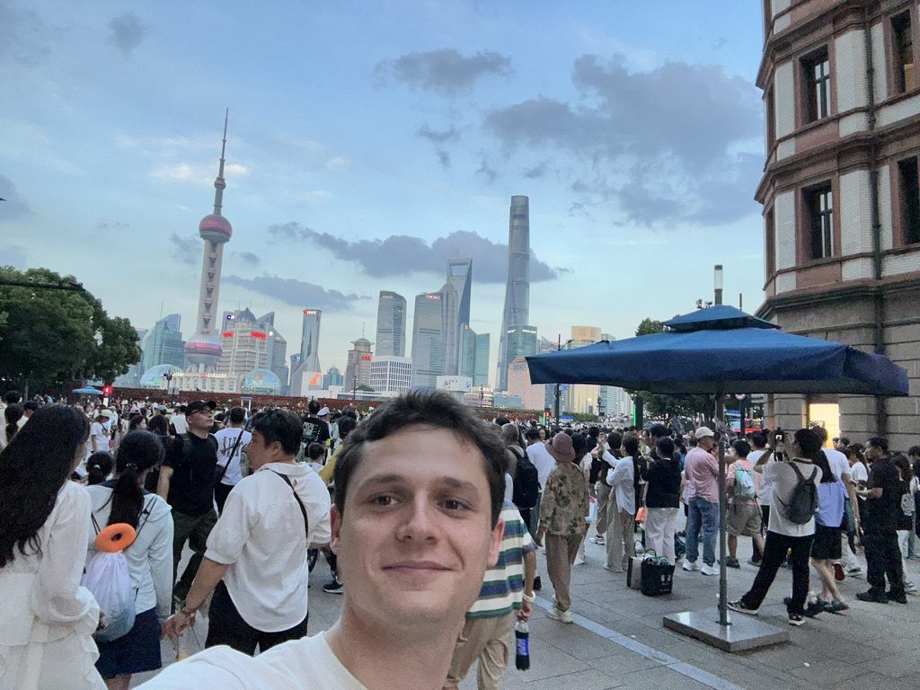 Aaron Gold on the Bund in Shanghai, with the Pudong skyline behind